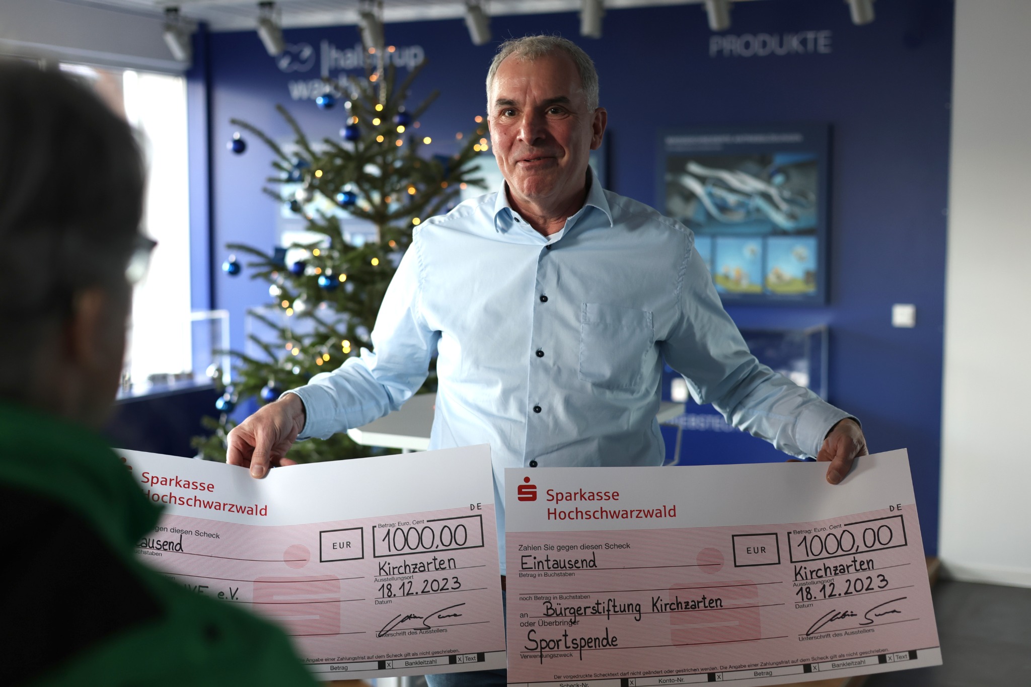 Managing Director Christian Sura handing over the donations